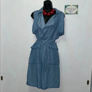 Blue knee-length sundress with wrap tie front and puff sleeves